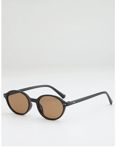 Détails de lunettes de soleil rondes rétro avec rivets argentés et verres bruns