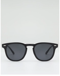 Close-up of black Wellington sunglasses with dark lenses and silver metal rivets