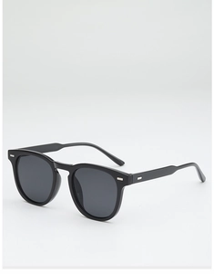Detail of black square sunglasses with silver rivets and dark polarized lenses