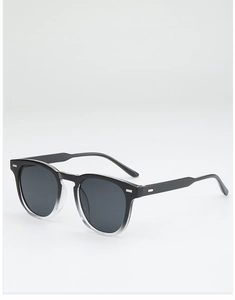 Close-up of black gradient sunglasses frame with silver metal accents and grey lenses
