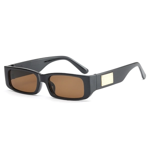 Retro narrow rectangular sunglasses with black thick frames and gold temple detail