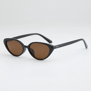 Classic cat-eye sunglasses featuring black frames and silver rivet details on the front