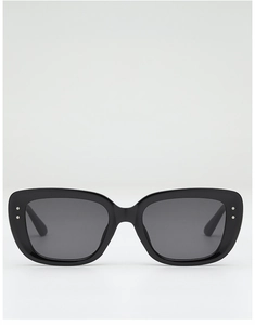 Detailed view of square black sunglasses featuring silver metal rivets and dark lenses