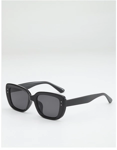 Detail of black square sunglasses with silver stud accents and dark tinted lenses
