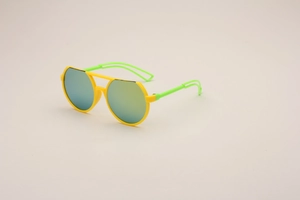 Close-up of kids sports sunglasses with yellow frame and neon green temples detail