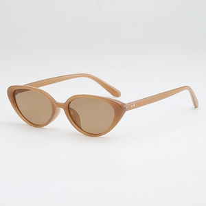 Retro cat-eye sunglasses in translucent amber brown with metallic dot details