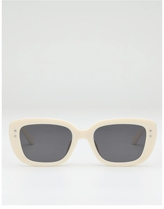 Front view of ivory rectangular sunglasses with silver metal studs and dark grey lenses