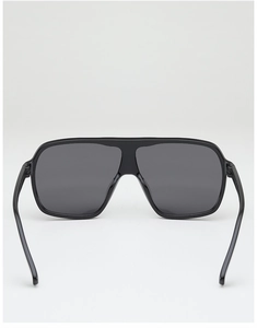 Detail view of large square oversized sunglasses featuring integrated nose pads in black