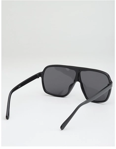Detail view of the black oversized sunglasses frame with model number CY5521 on the temple