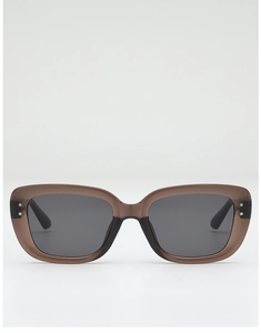 Close-up of stylish rectangular brown frames with classic silver stud accents on sunglasses