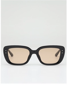 Detail of black square sunglasses with silver rivet accents and tinted brown lenses
