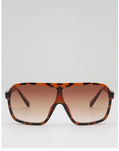 Detail of oversized square tortoiseshell sunglasses with brown gradient lenses and flat top