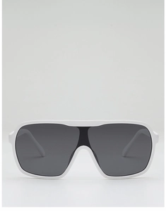 Close-up of white oversized flat top sunglasses with deep grey lenses and thick frame