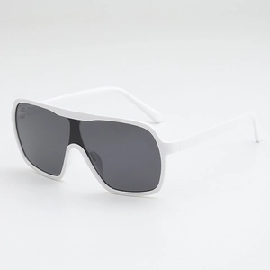 Detail view of white wide-frame sunglasses with dark grey lenses and sleek flat top