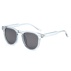 Retro light blue transparent round sunglasses with dark grey lenses and metal hinge details