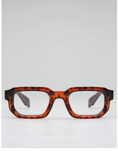 Detailed view of tortoiseshell frame texture and metal hinge on square glasses