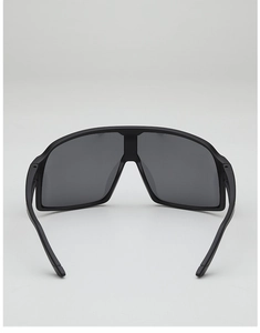 Detail view of matte black oversized cycling sunglasses with integrated nose pads