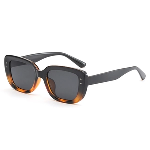 Modern square gradient sunglasses with black and amber frames and metal rivets for unisex