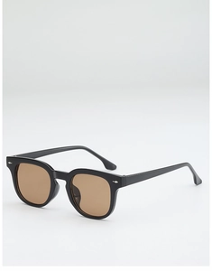 Classic square sunglasses with black frame and brown UV lenses seen from a side angle
