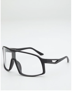 Detail of matte black sports eyewear featuring cutout temples and clear oversized lens
