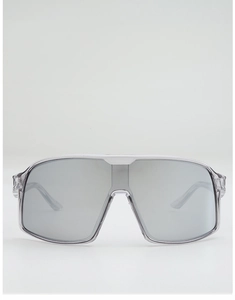 Detail view of silver mirror lenses and translucent gray frame on sports cycling sunglasses