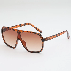 Oversized shield sunglasses with tortoise shell frames and brown gradient lenses