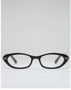 Close-up of black cat-eye glasses frame featuring metallic AC logo detail on the temple