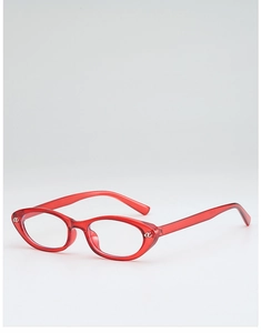 Detail of red transparent cat-eye glasses with silver metal accents and sleek finish