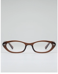 Detail of amber tortoiseshell cat eye frames with silver letter accents on the side