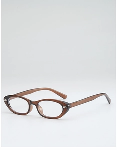 Detail shot of tortoiseshell cat-eye glasses frame with golden metal hinge logo