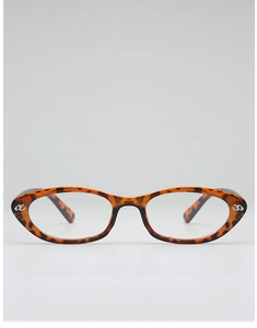 Detail of tortoise shell cat eye frames with silver metal letter inlay on front