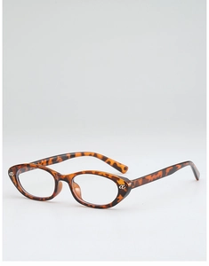 Detail of tortoiseshell cat-eye glasses frame with silver metal logo and amber texture