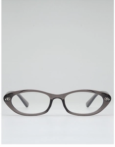 Close-up of translucent dark grey cat eye glasses with silver hollow metal logo detail