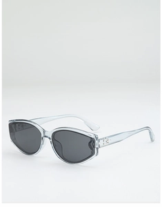 Detail of silver geometric logo on light blue cat eye sunglasses with gray lenses