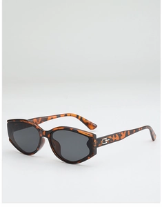 Detailed view of tortoiseshell cat-eye sunglasses with silver metal hinge accents