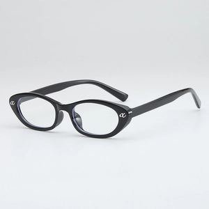 Modern black cat-eye glasses frame with metal ac logo, 45-degree angle view on grey background
