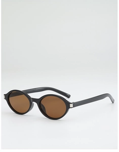 Detail view of black oval frame sunglasses with brown lenses and silver metal temple accents