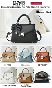 Detailed view of structured crossbody bag featuring bow decor and 22x9x16cm dimensions