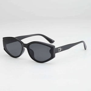 Modern black cat-eye sunglasses with silver metal accents and dark UV protection lenses