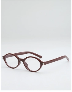 Detail of dark red oval eyewear frame with silver square hinge and clear lenses