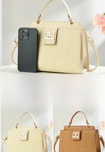 Detail of woven patchwork crossbody bag with B-logo buckle and smartphone size comparison