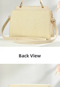 Detail view of the back of a cream woven crossbody bag with premium leather accents