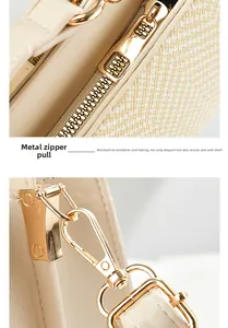 Detail of high-quality golden hardware zipper and lobster clasp on beige tote bag