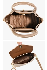 Macro view of brown lychee grain leather bag interior with striped lining and magnetic buckle