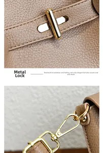 Polished gold hardware lock and strap hook on premium khaki lychee texture leather bag