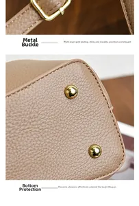 Detail of coffee brown lychee grain leather bag with gold hardware and bottom studs