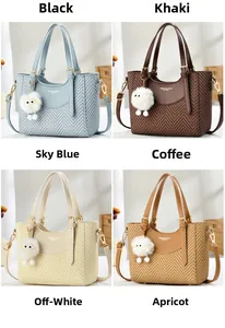 Detail of color options for patchwork handbag with textured fabric and plush charm