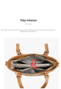 Detail of multi-compartment interior with fabric lining in a straw-leather handbag