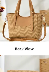 Detail of brown woven texture and gold hardware on a stylish crossbody handbag