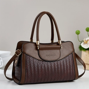 Brown woven texture pillow bag for women featuring a spacious top handle and crossbody strap
